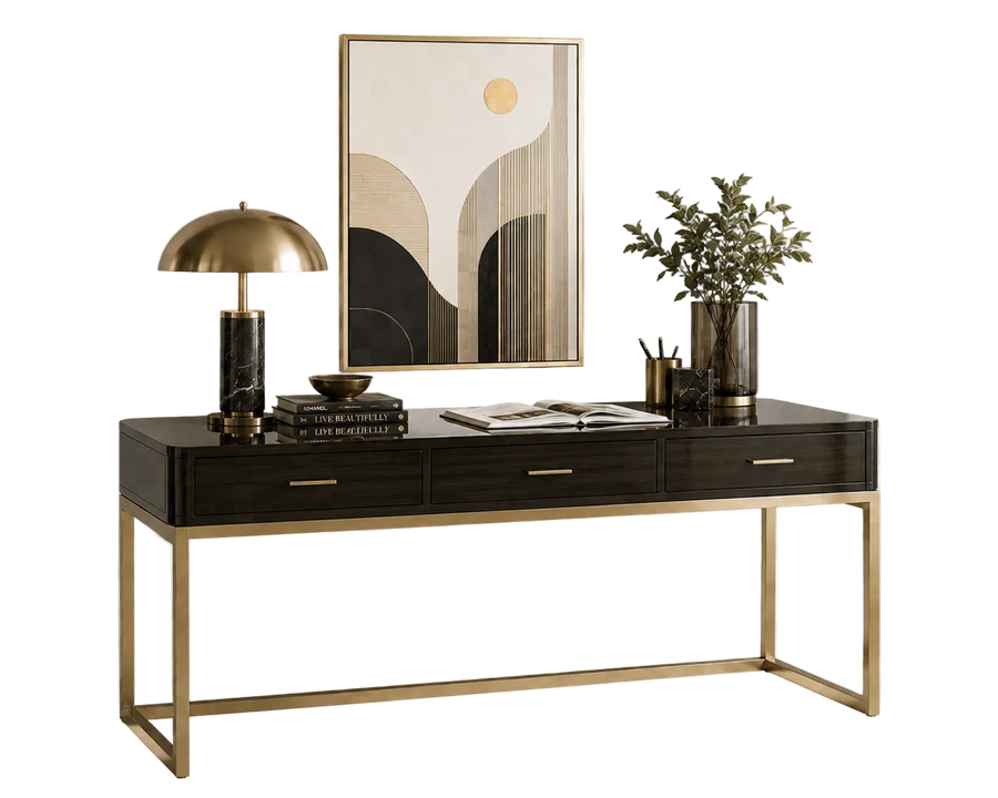 Modern desk with gold legs, lamp, books, and decor on a white background