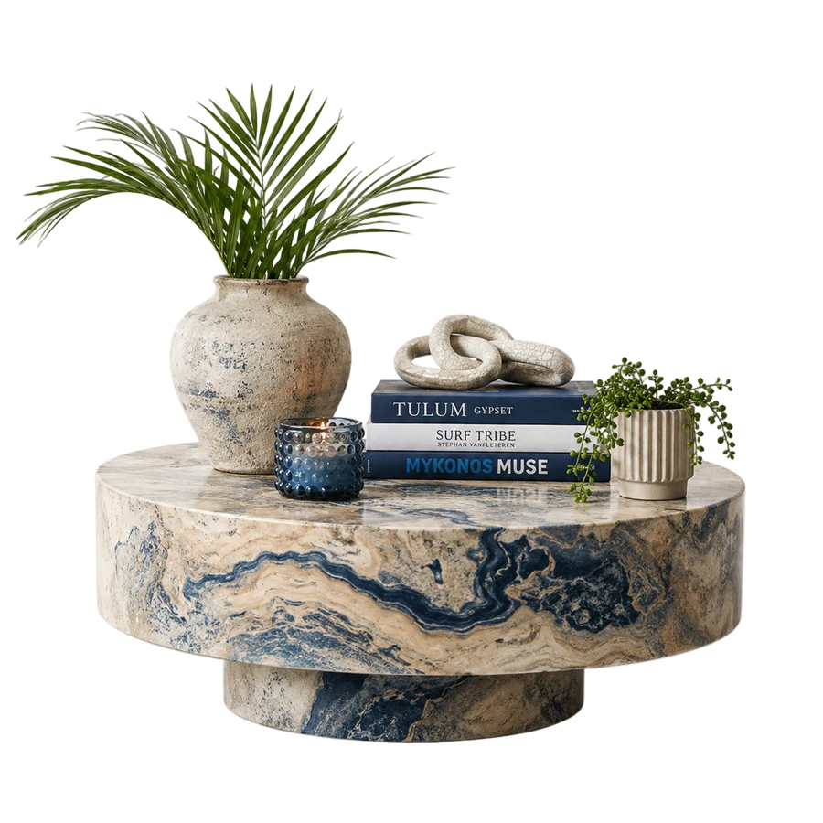 Marble coffee table with decorative items including a plant, books, and candles on a white background