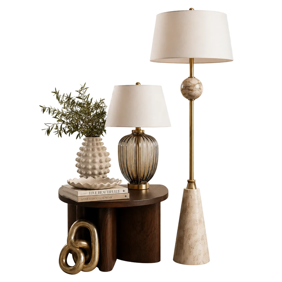 Decorative table with lamps and a plant on a white background